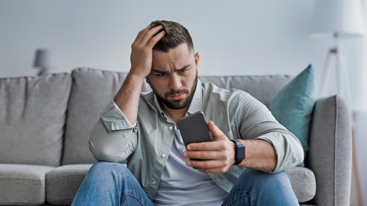 Man is upset while looking at his phone