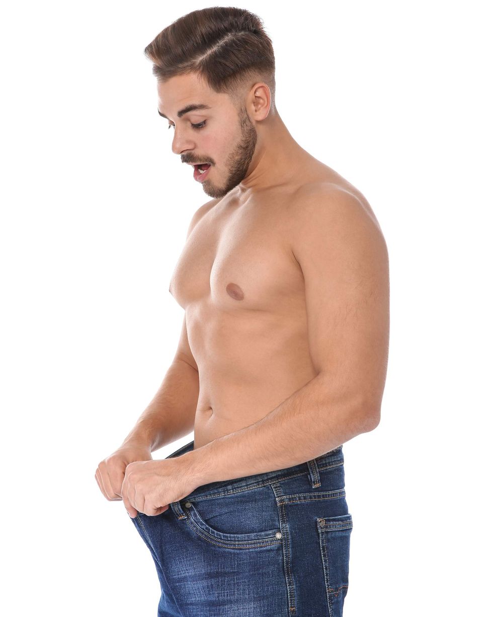 Man looking down his pants
