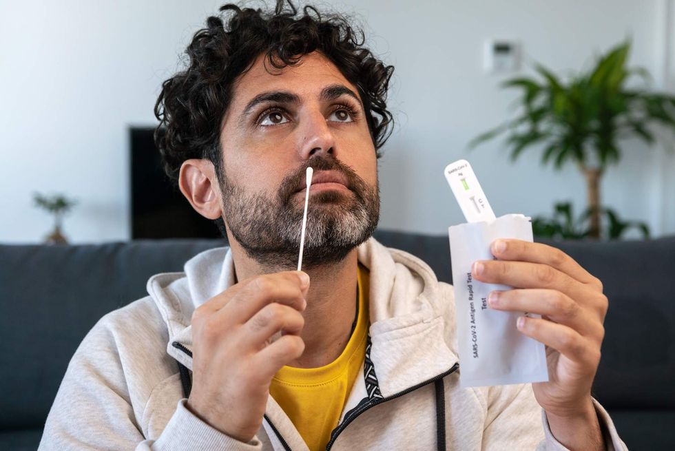 Man taking a COVID-19 test