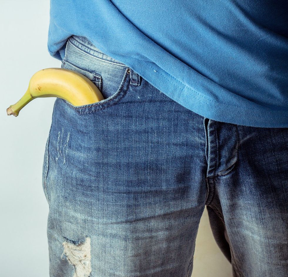 man wearing jeans with a banana in his side pocket