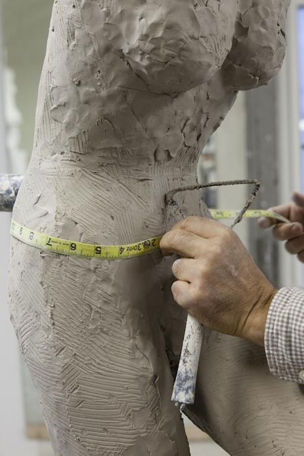 Mannequin Sculpture Being Measured