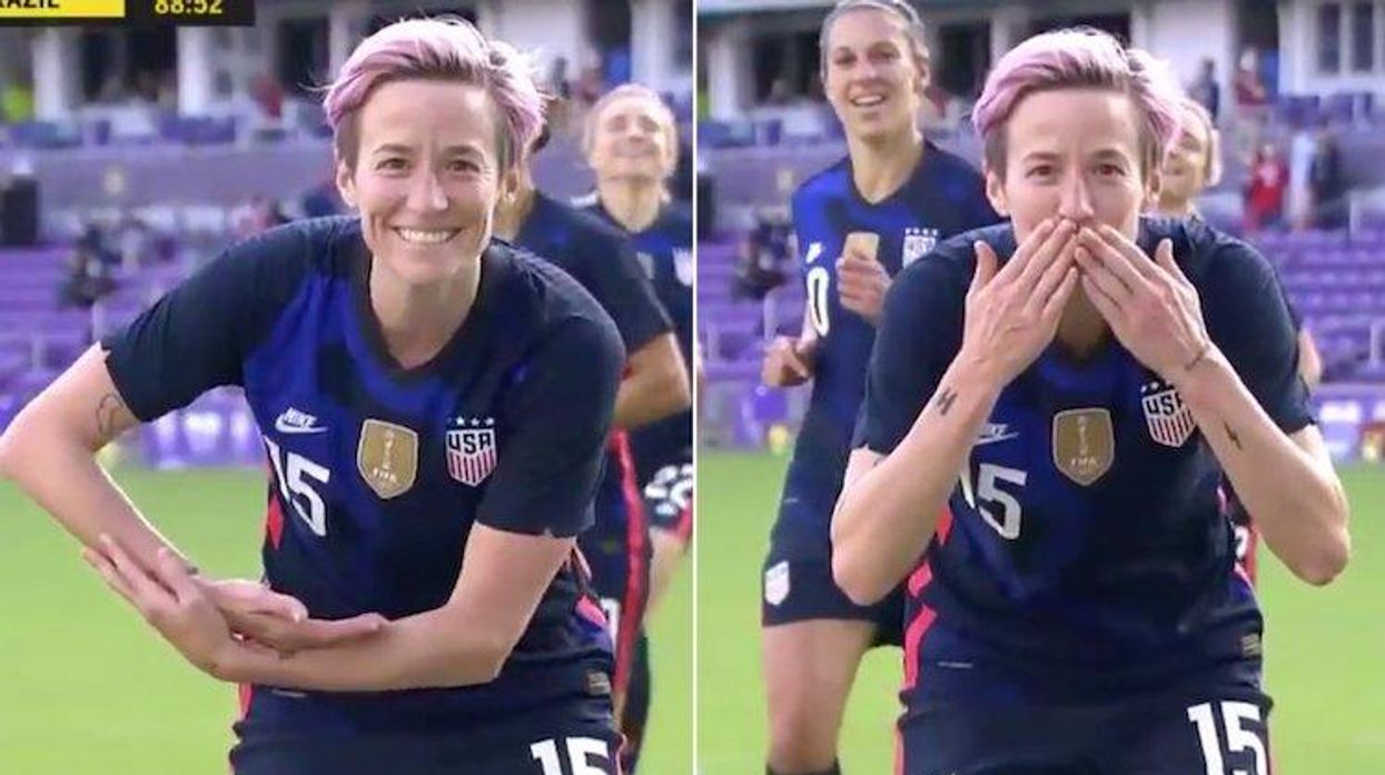 Megan Rapinoe blowing kiss to Ali Krieger and Ashlyn Harris