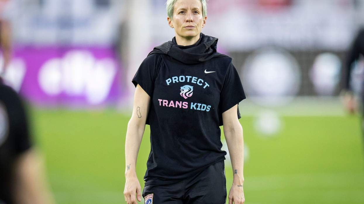 megan rapinoe wears a shirt that says protest trans kids
