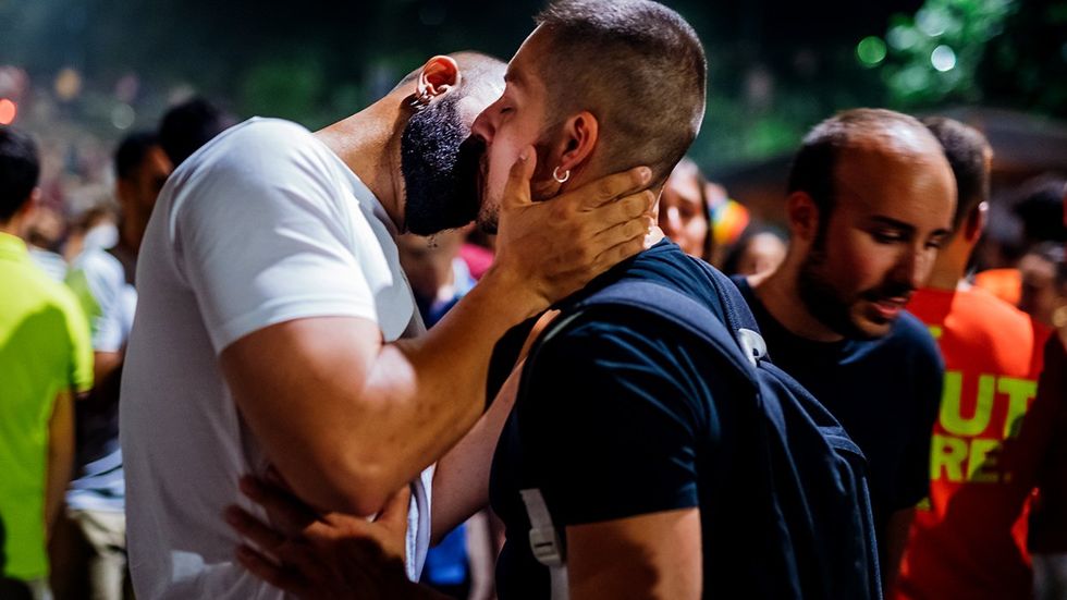 Men kissing making out patio gay bar lgbtq nightclub 