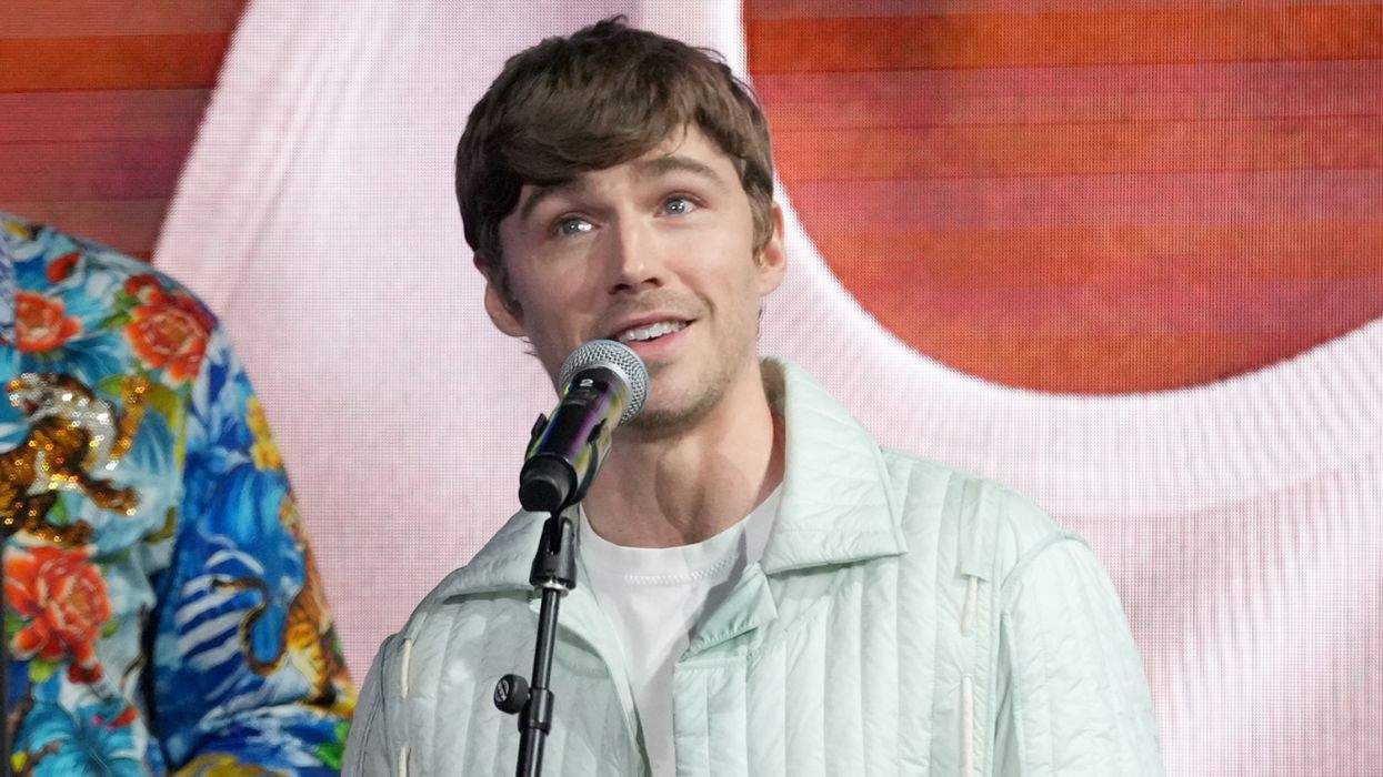 Miles Heizer speaks onstage during the Out100