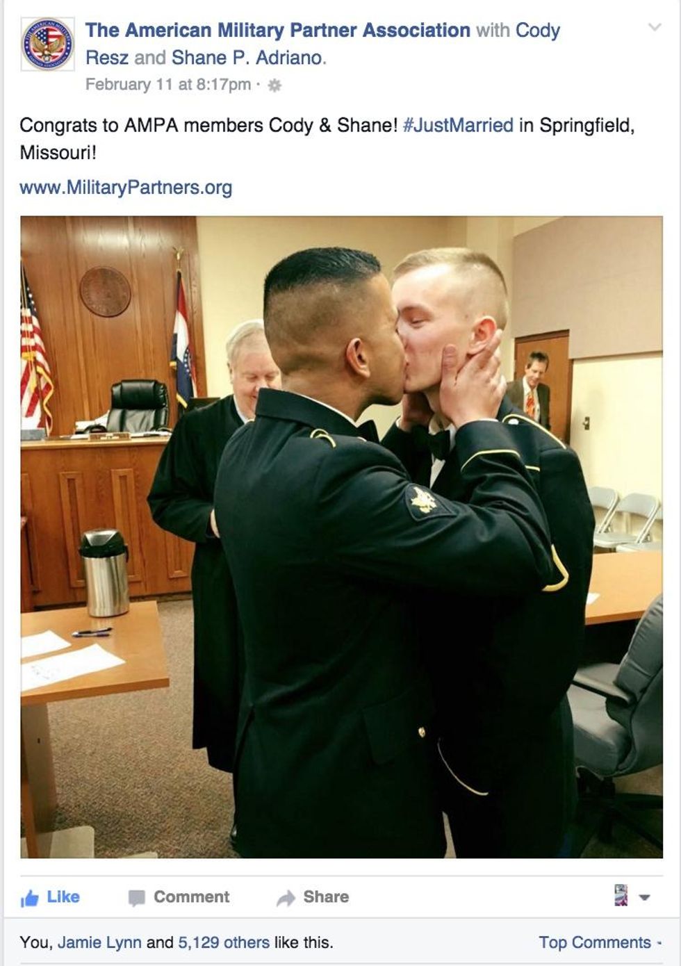 Military kiss shared by American Military Partner Association.