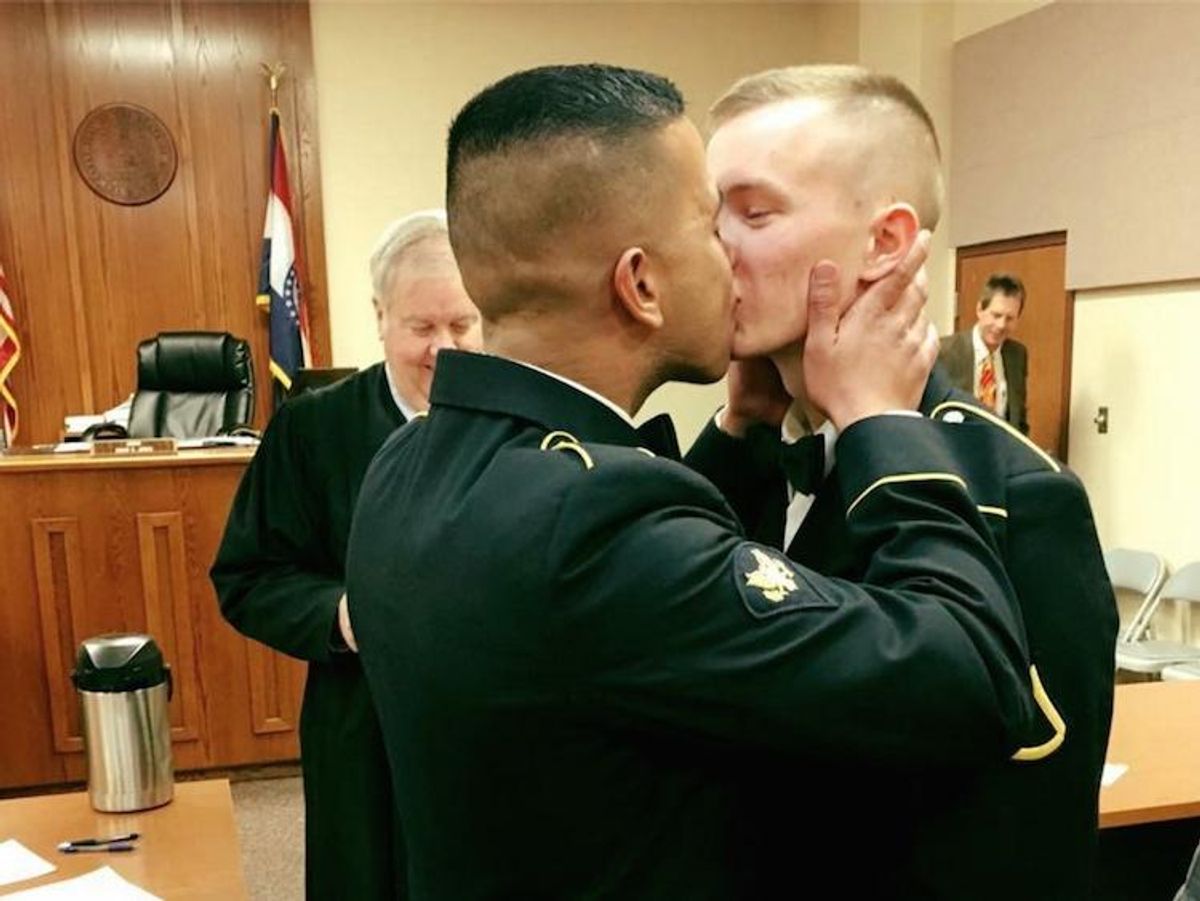 Military service members celebrate their marriage.