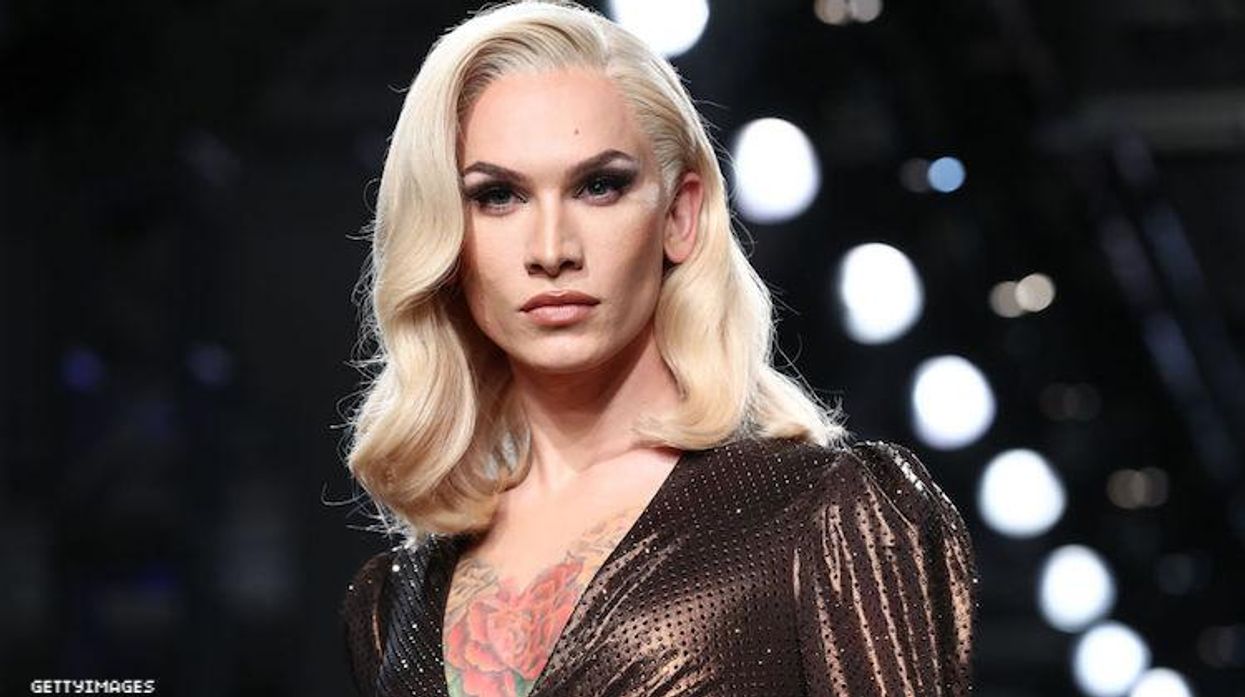 Miss Fame walking in a fashion show.