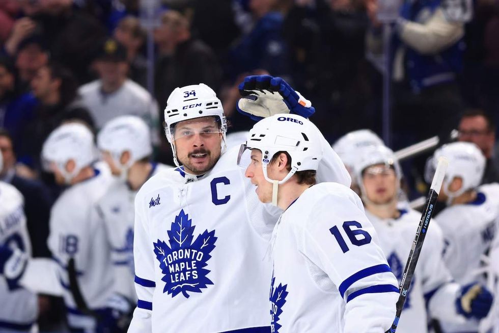 Mitch Marner #16 of the Toronto Maple Leafs is congratulated by Auston Matthews #34 of the Toronto Maple Leafs following his third period goal against the Buffalo Sabres