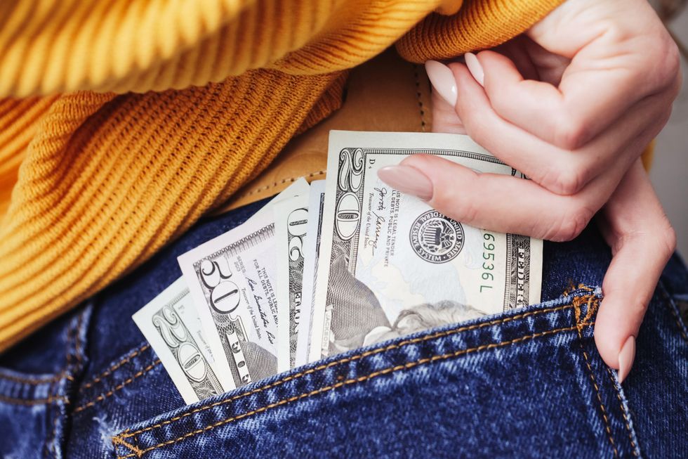 Money in a woman's back pocket