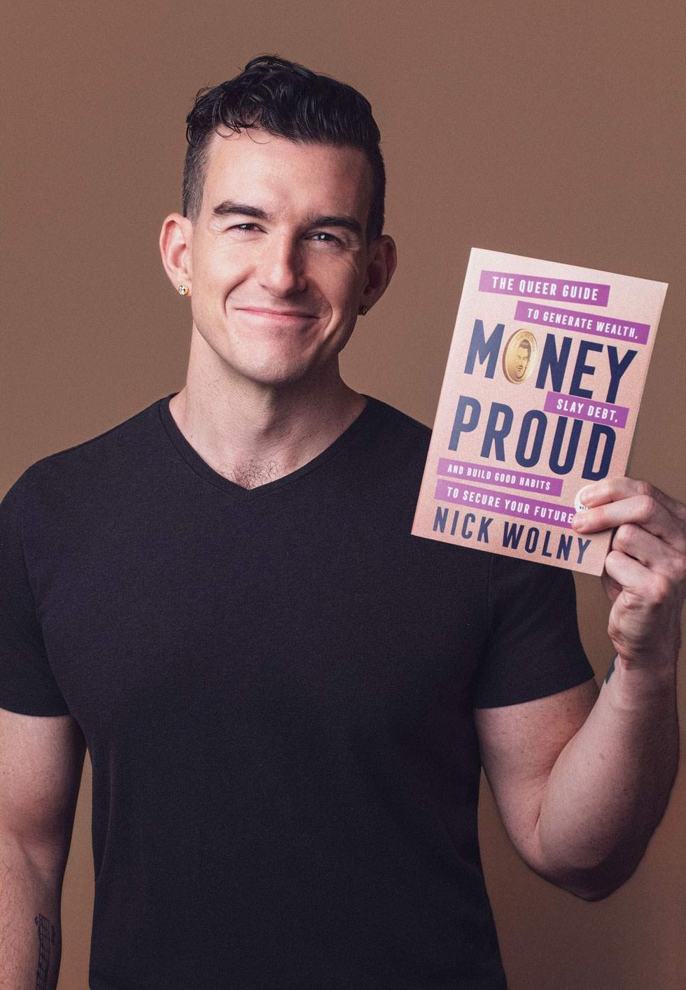 Nick Wolny with his new book Money Proud