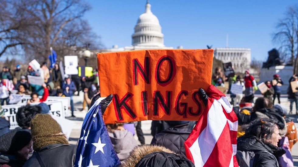 NO KINGS in america protest sign at the captiol building february 2025