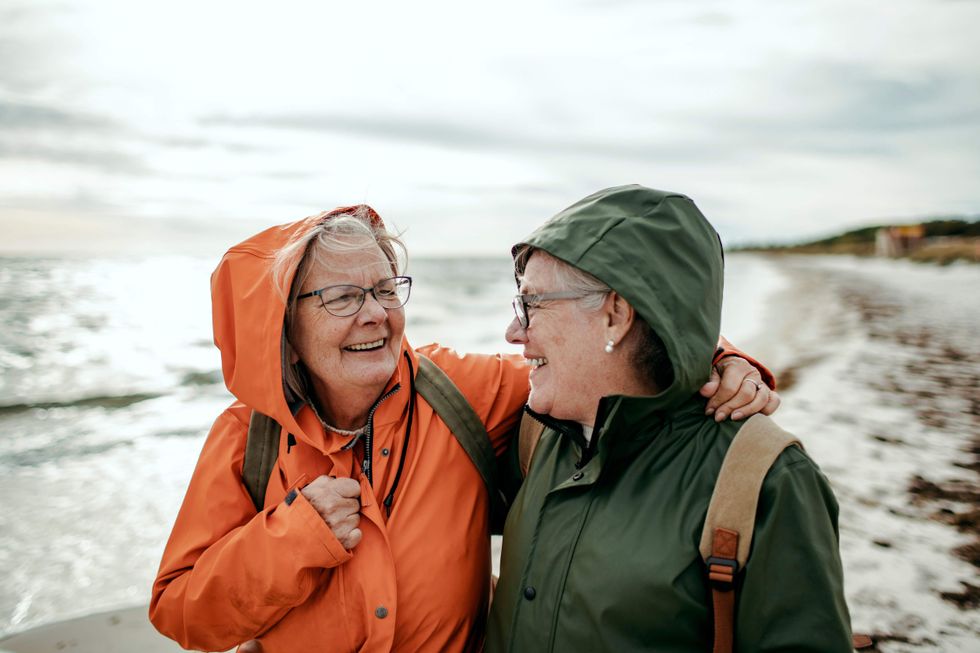 Older lesbian couple in raincoats