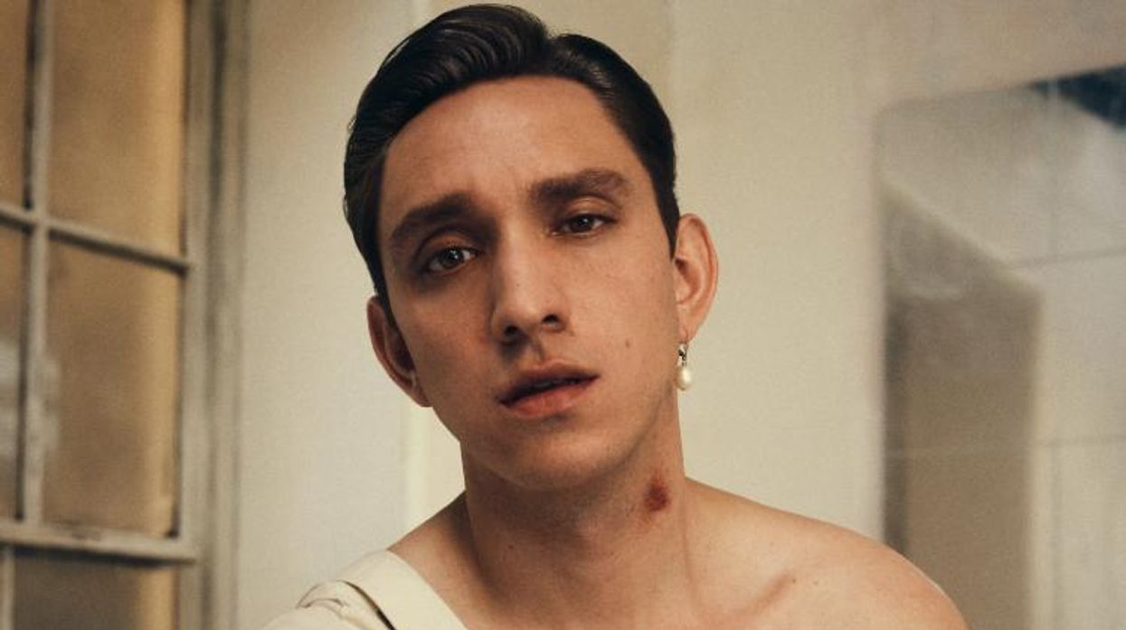 Oliver Sim in a music video