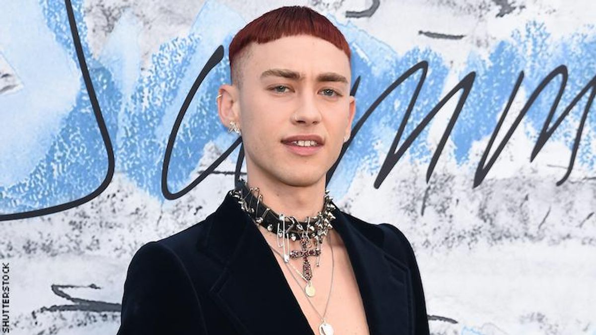 Olly Alexander on a red carpet.