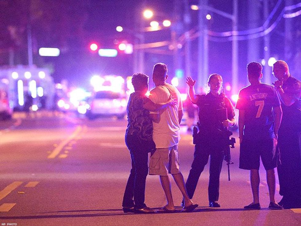 Orlando Police officers direct family members away from the fatal shooting at Pulse in Orlando.