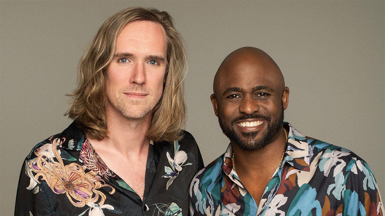 Out editor in chief Daniel Reynolds and Wayne Brady