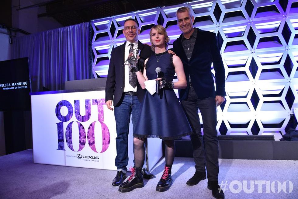 OUT Executive Vice President Joe Landry (left) and OUT Editor In Chief Aaron Hicklin (right) present Chelsea Manning (center) with The OUT100 Newsmaker Of The Year Award