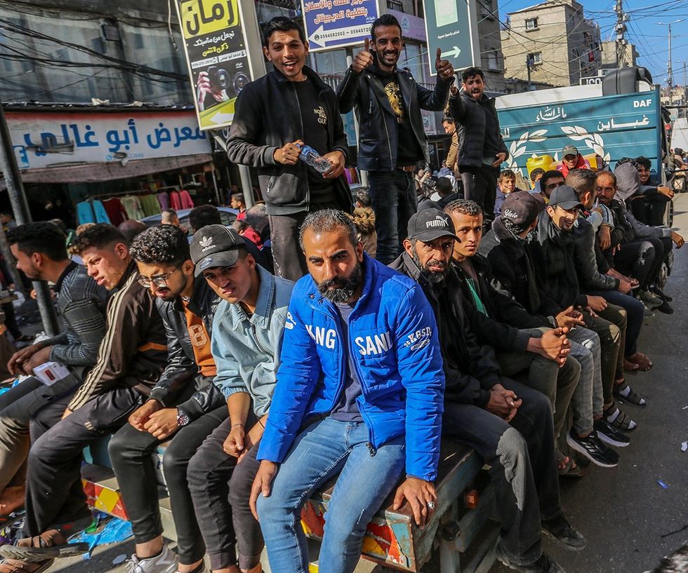 Palestinians crowd at a local street market in Rafah Gaza Strip January 2024