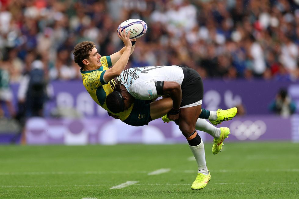 Paris 2024 Olympics Men's Rugby Players Tackling Holding Each Other