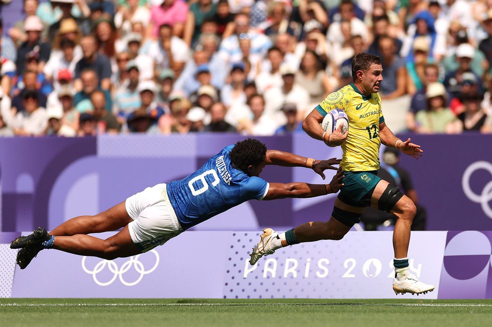 Paris 2024 Olympics Men's Rugby Players Tackling Holding Each Other