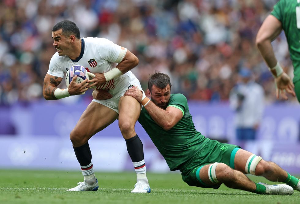 Paris 2024 Olympics Men's Rugby Players Tackling Holding Each Other