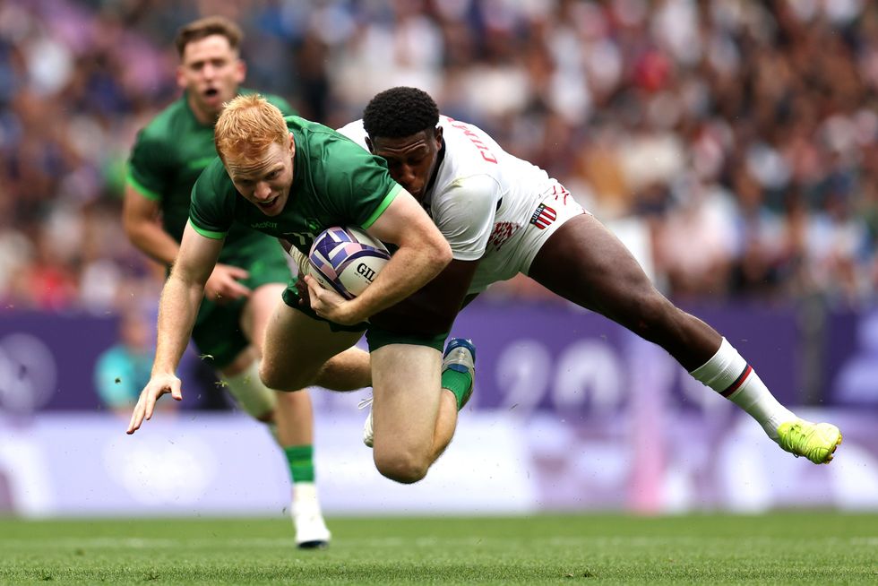 Paris 2024 Olympics Men's Rugby Players Tackling Holding Each Other