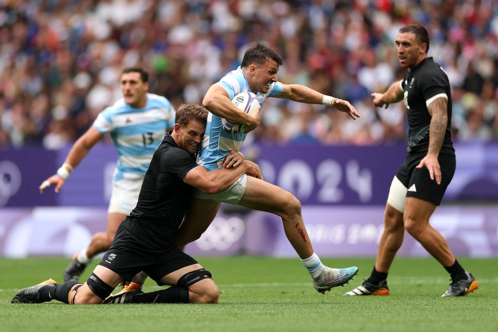 Paris 2024 Olympics Men's Rugby Players Tackling Holding Each Other