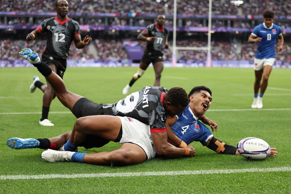 Paris 2024 Olympics Men's Rugby Players Tackling Holding Each Other