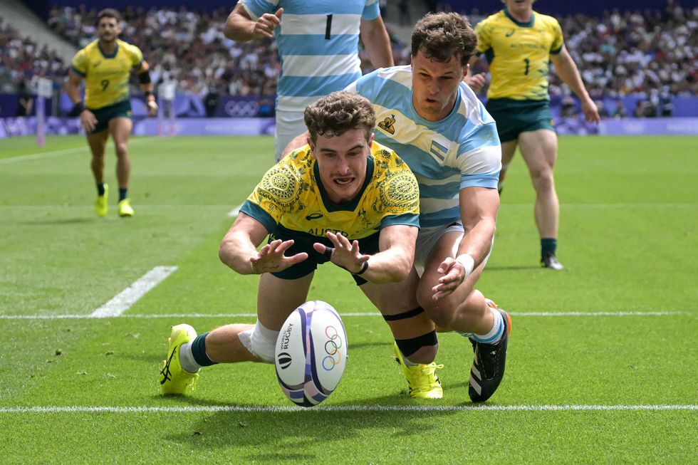 Paris 2024 Olympics Men's Rugby Players Tackling Holding Each Other