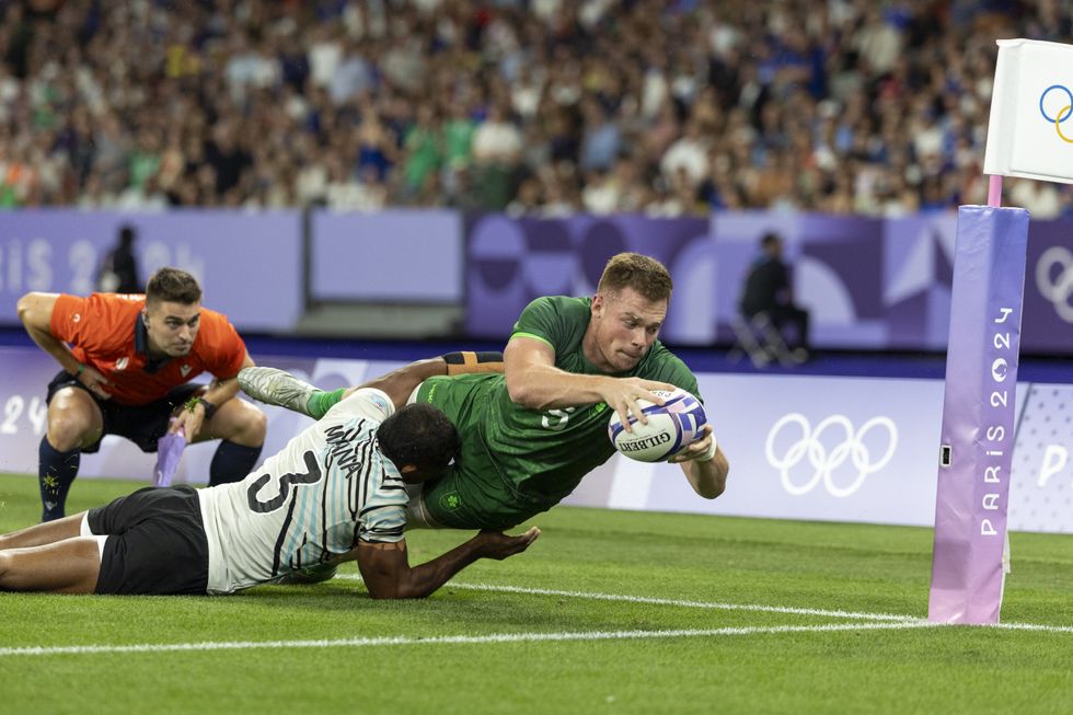 Paris 2024 Olympics Men's Rugby Players Tackling Holding Each Other