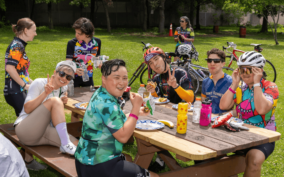 Participants gather for a meal during Pride Ride
