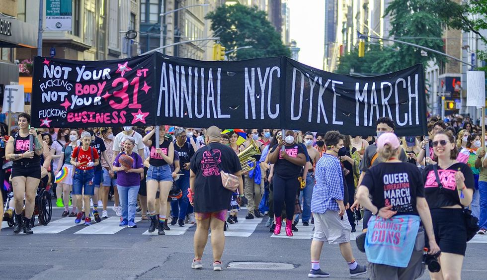 Participants holding march banner during 31st Annual Dyke March along Fifth Avenue New York City June 2023