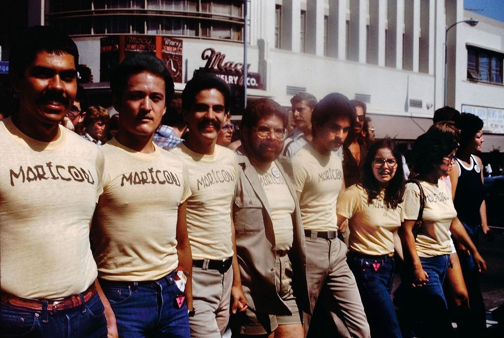Participants of the Christopher Street West Pride parade in June of 1976 wear shirts designed by artist Joey Terrill