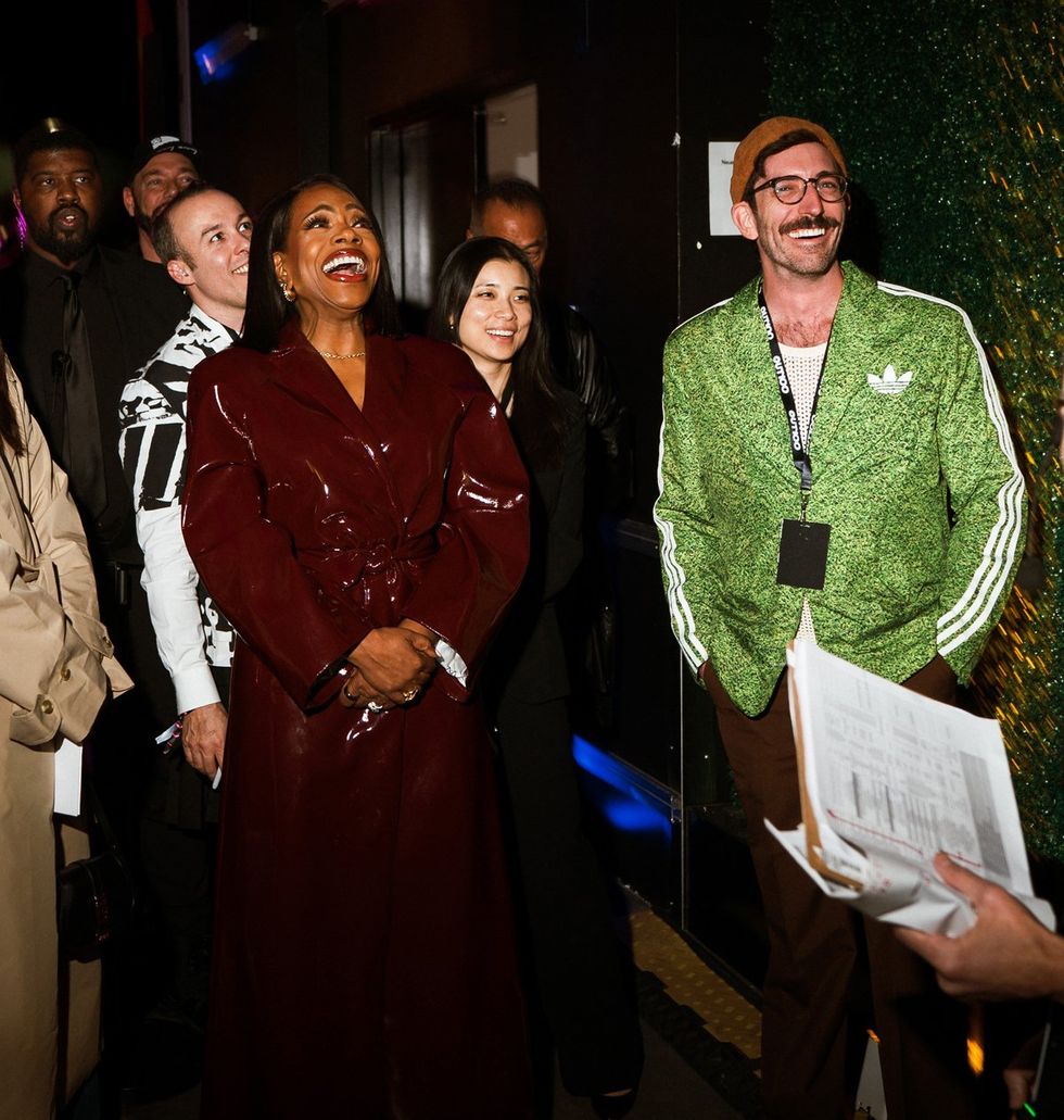 photo gallery queer photographer Roland Fitz Out100 2024 party pics crowd laughing focus on Sheryl Lee Ralph and Tim Snow