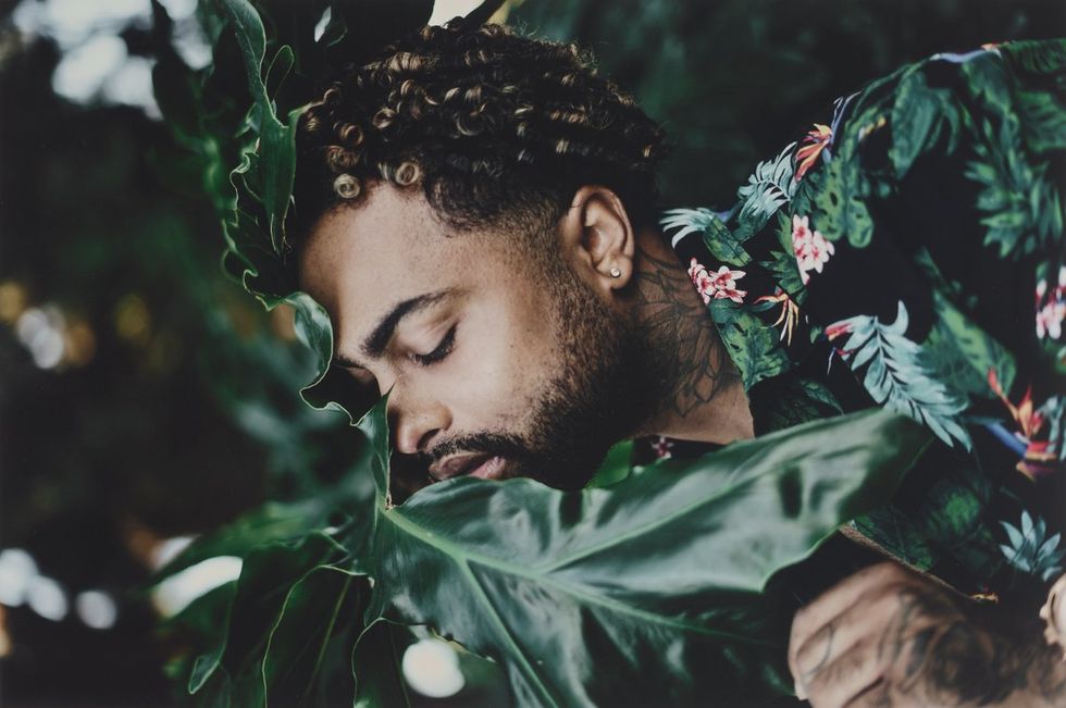 photograph\u200b bearded man with plants included in Queer Lens A History of Photography book
