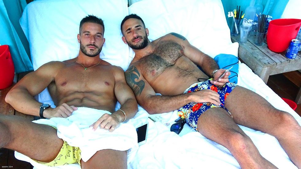 Pictured above: Guest Eliad Cohen (right) and friend enjoying the balmy breezes at the White Party. Eliad was there hosting the Big Top Party at Almar.Read more below.