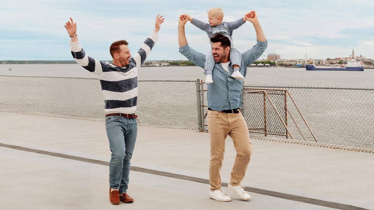 PJ Wilson, Stephen Walker, and their son, Theo, take a stroll in Charleston