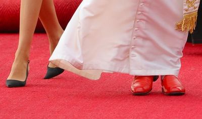 why do popes wear red shoes