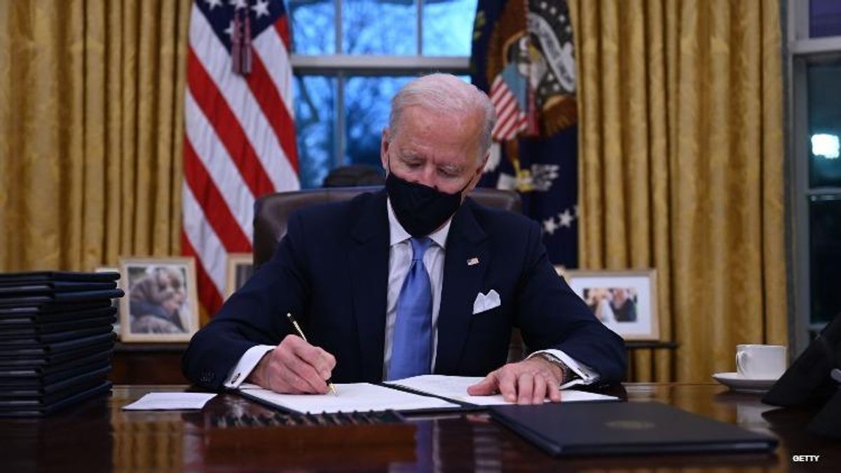 President Joe Biden signing executive order.