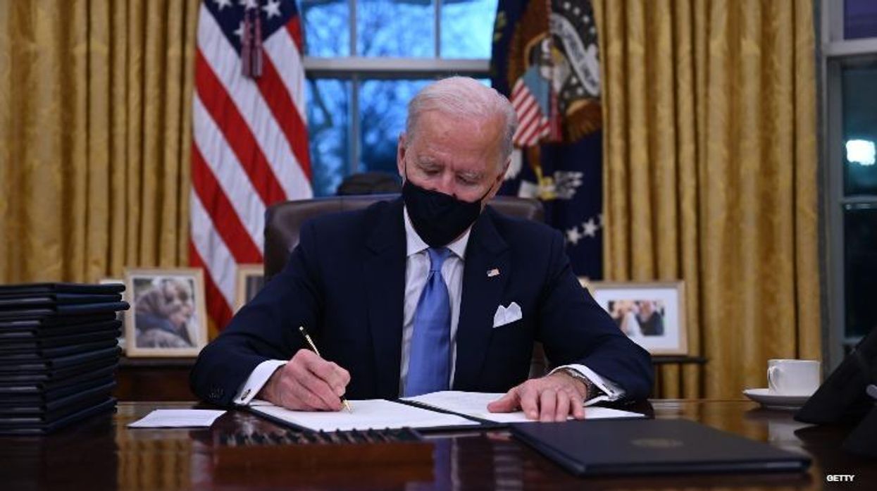 President Joe Biden signing executive order.