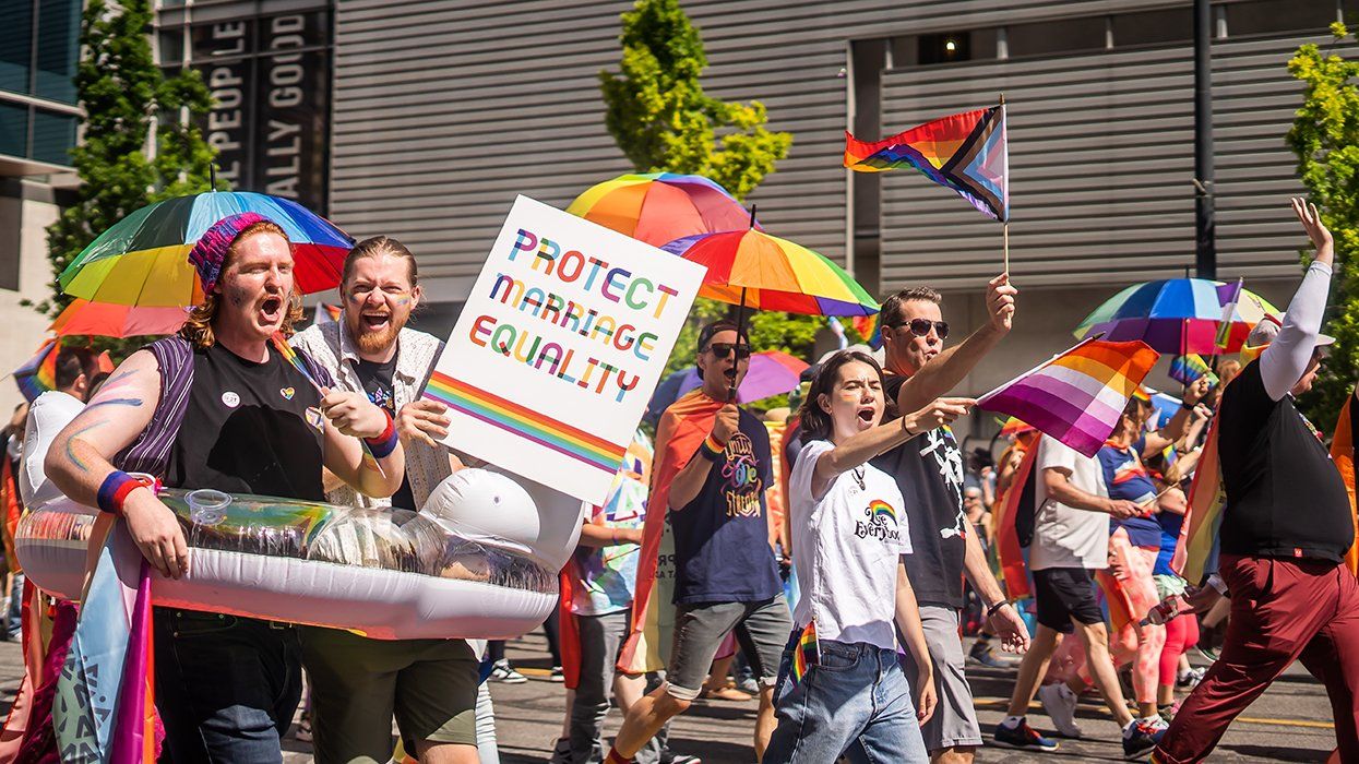 protect marriage equality sign and many rainbow flags at LGBTQIA pride march Salt Lake City Utah June 2024