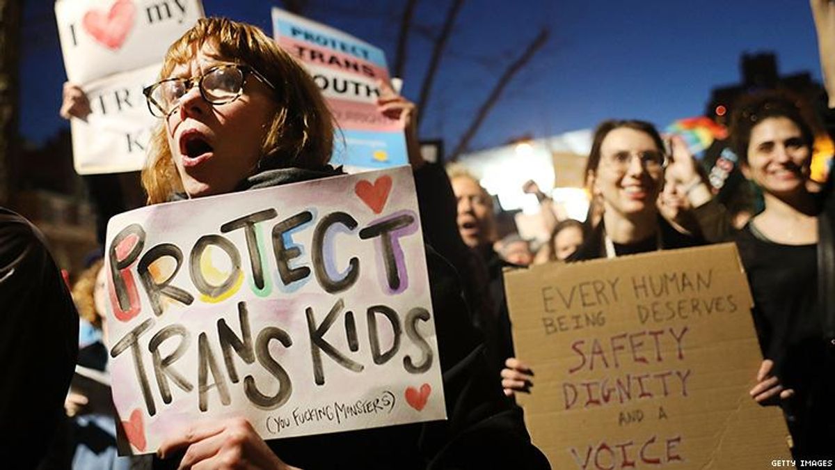 "Protect trans kids" protest sign