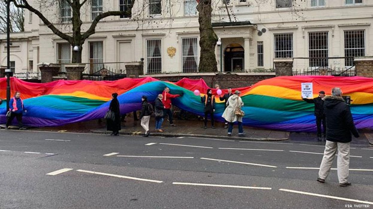 Protesters in London wrap Russian embassy in rainbow flag to help. LGBTQ+ Chechens seeking asylum.