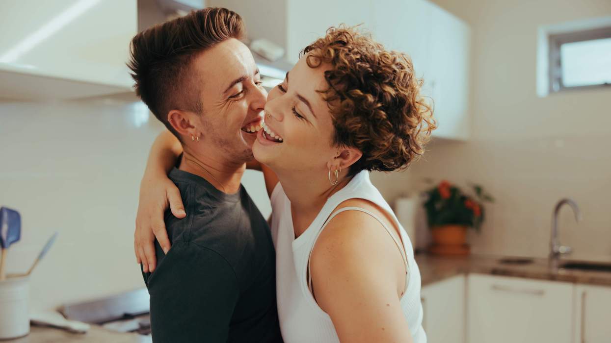 Queer couple laughing