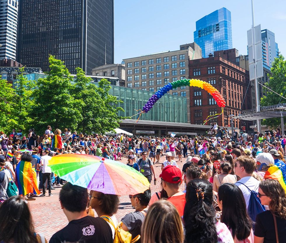 Rainbow flags and crowds of people celebrating downtown Boston Pride 2019