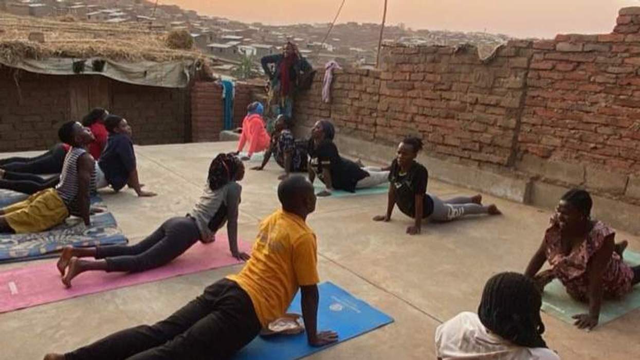 refugees practicing yoga at Dzaleka Refugee Camp in Malawi