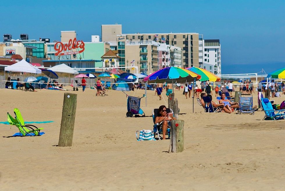 Rehoboth Beach Delaware Vacationers enjoy a hot sunny day at the beach