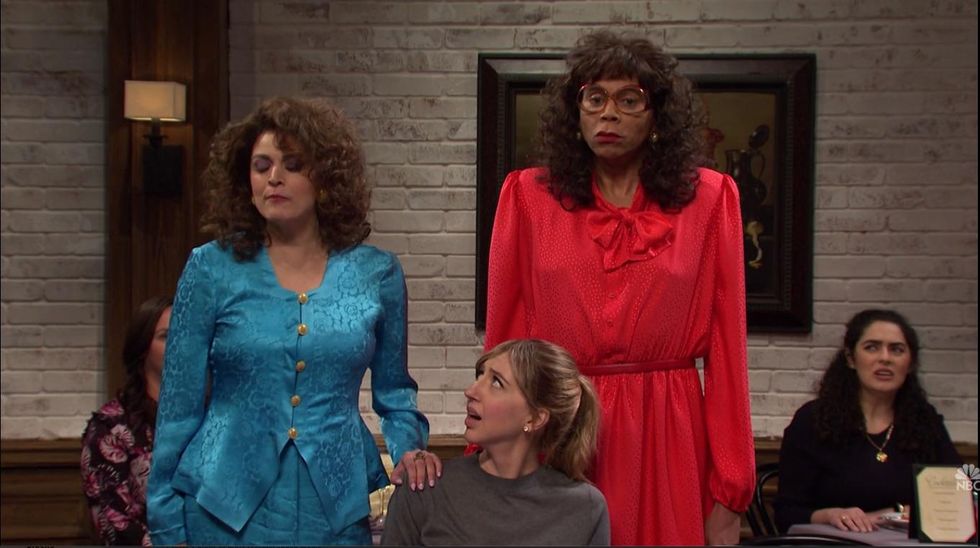 RuPaul dressed as a disgruntled older woman.