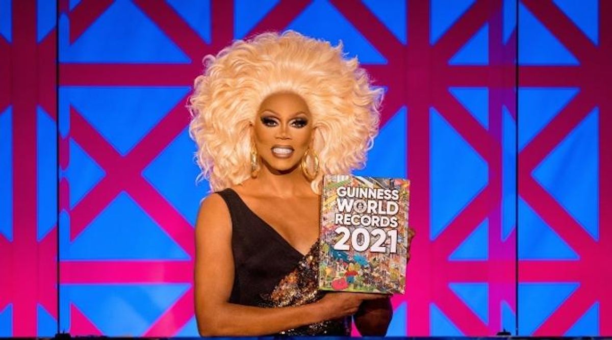 RuPaul holding Guinness World Records book.